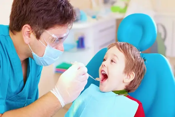 a boy in the dentist office