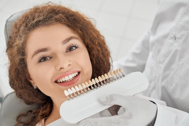 a woman choosing dental veneers