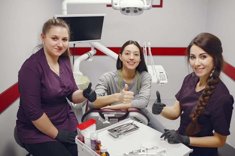 three woman in dentist 