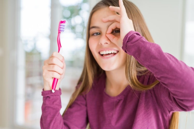 a teen having toothbrush for better Oral Hygiene